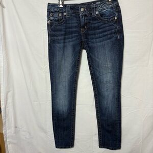 Miss Me women's skinny jeans in a dark wash blue denim with rhinestone accents